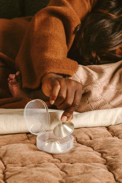 Le Lolo 999 silver nursing cups with intricate engraved design, showcasing traditional handcrafted craftsmanship.