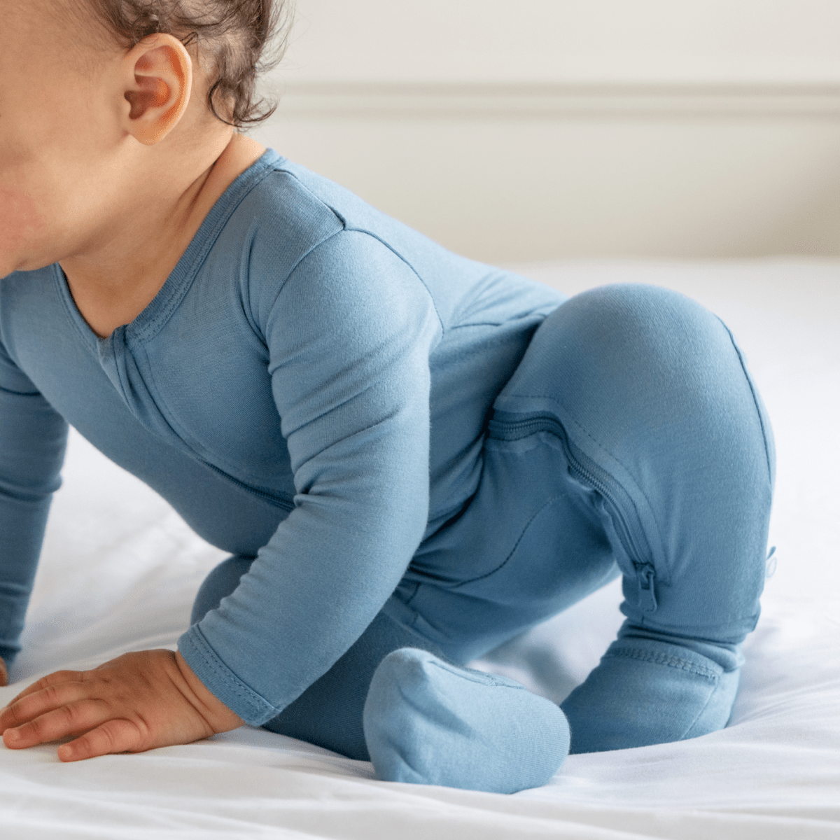 Baby in Dreamland Baby bamboo pajamas with DreamCuffs®, soft fabric, and cozy design for restful sleep.