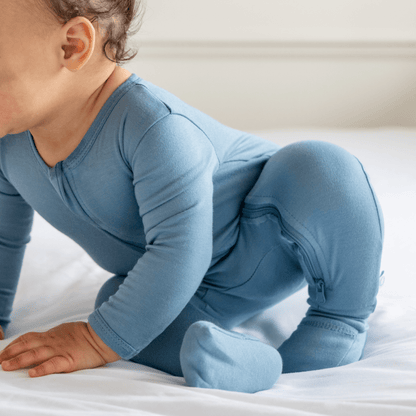 Baby in Dreamland Baby bamboo pajamas with DreamCuffs®, soft fabric, and cozy design for restful sleep.