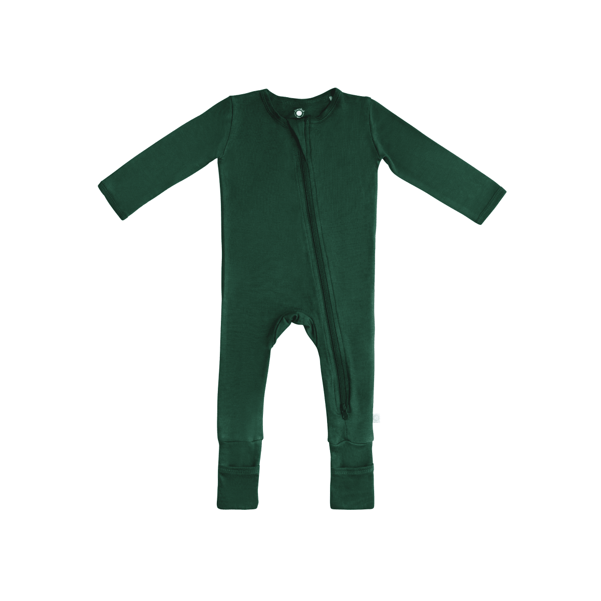 Baby in soft bamboo pajamas with DreamCuffs® by Dreamland Baby, featuring footed design and cozy, breathable fabric.
