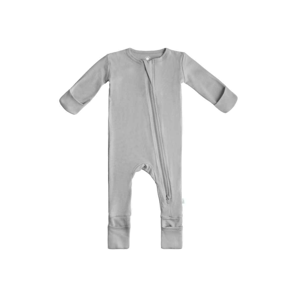 Baby wearing Dreamland Baby bamboo pajamas with DreamCuffs®, soft fabric and cozy fit in a calming sleep environment.