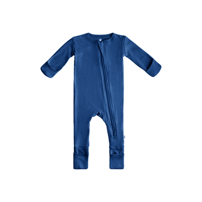Baby wearing Dreamland Baby bamboo pajamas with DreamCuffs®, soft fabric and cozy fit, perfect for restful sleep.