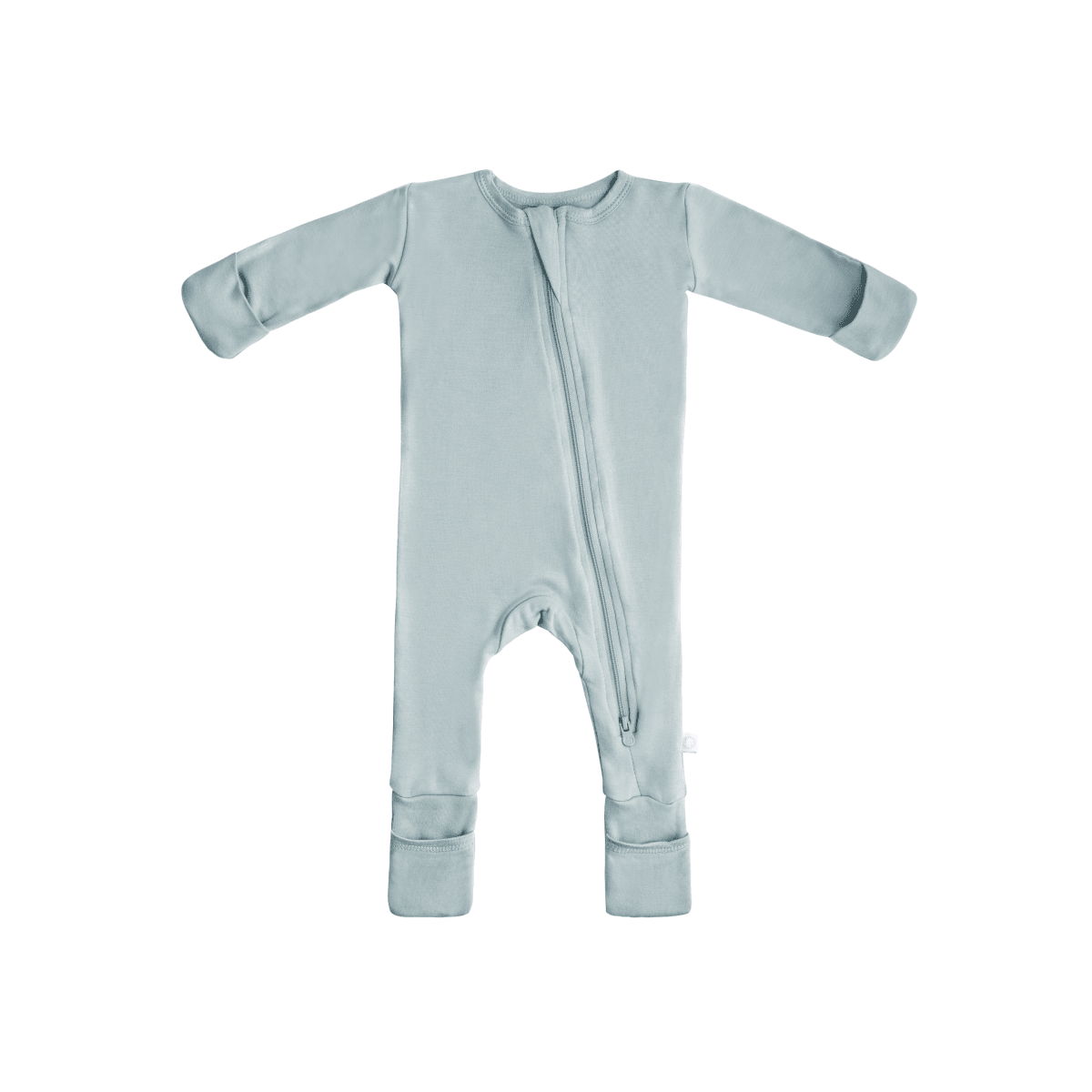 Baby in soft bamboo pajamas with DreamCuffs® by Dreamland Baby, featuring a cozy, comfortable fit and adorable design.