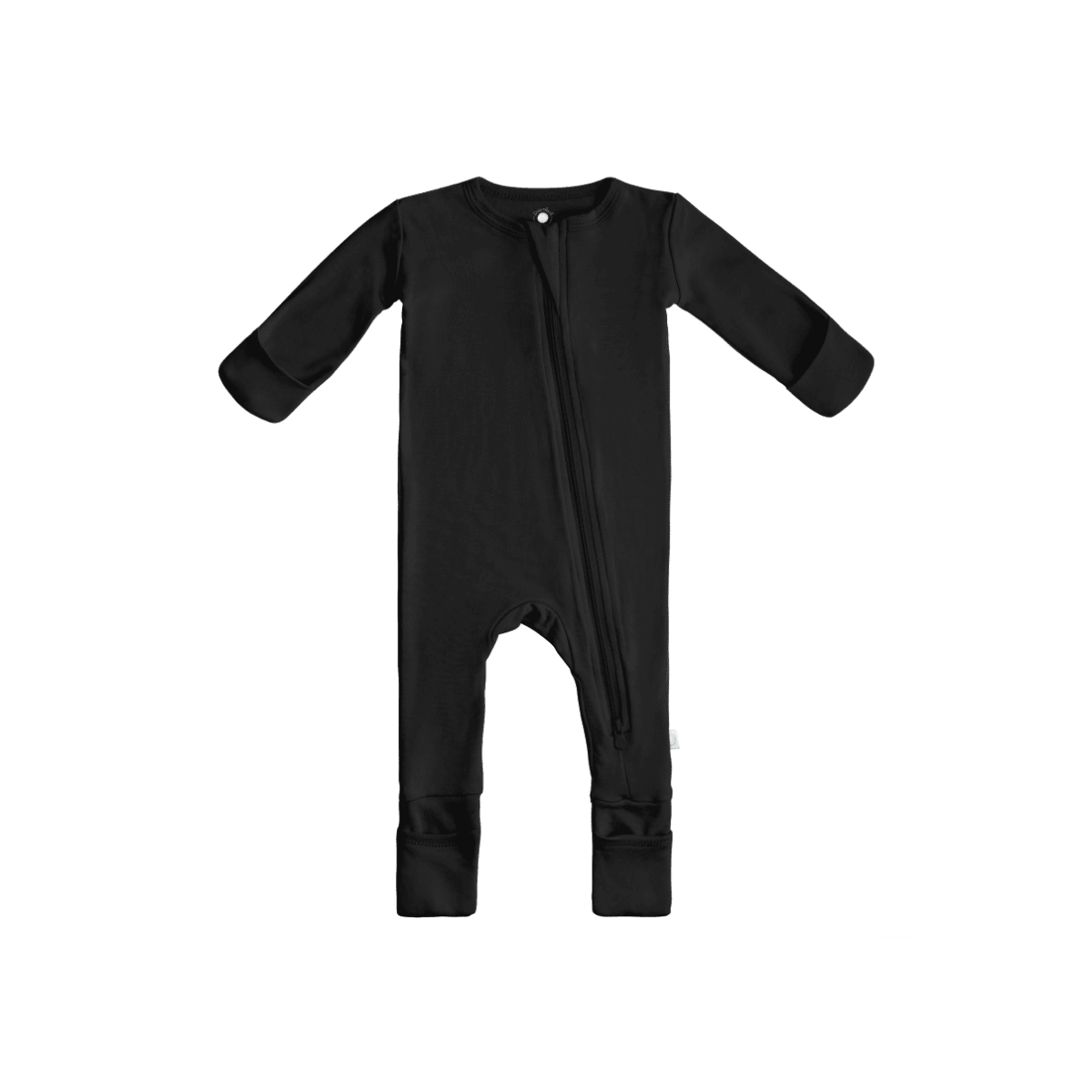 Baby in soft bamboo pajamas with DreamCuffs® from Dreamland Baby, featuring a cozy sleepwear design and adjustable cuffs.