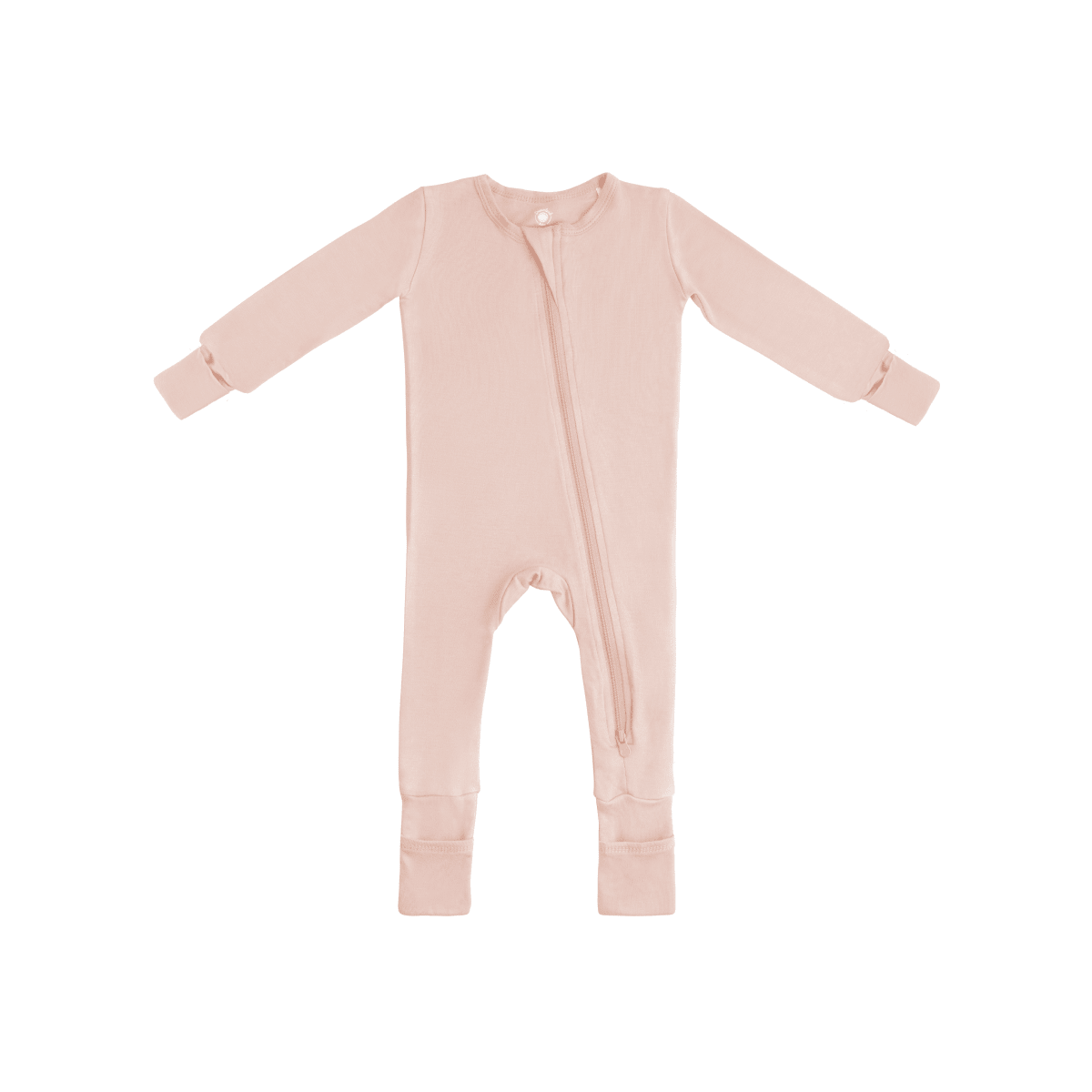 Baby in soft bamboo pajamas with DreamCuffs® from Dreamland Baby, lying peacefully in cozy sleepwear.