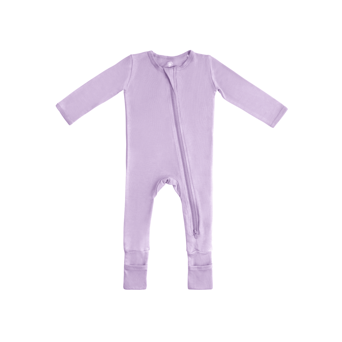 Baby in Dreamland Baby bamboo pajamas with DreamCuffs®, soft fabric and snug fit, lying on a cozy bed.