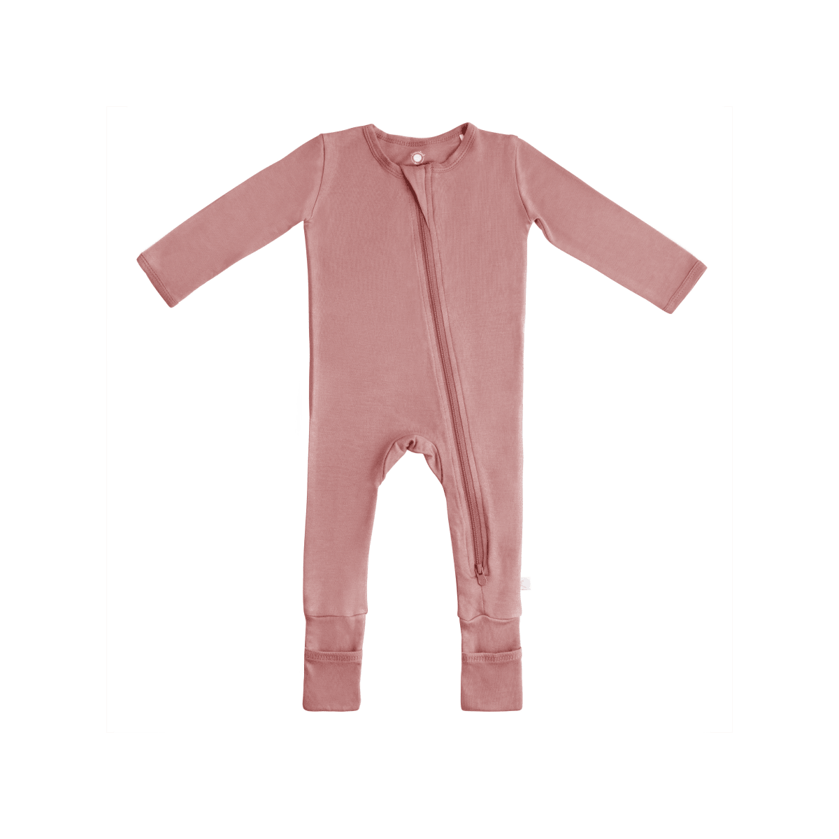 Baby wearing Dreamland Baby bamboo pajamas with DreamCuffs®, featuring soft fabric and snug fit for comfortable sleep.