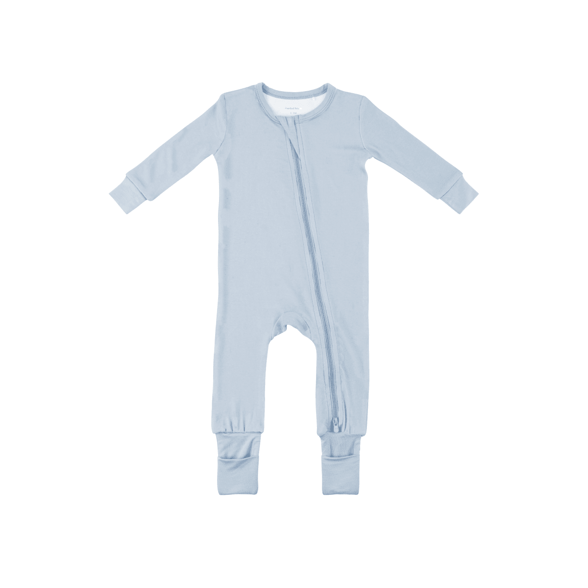 Baby wearing Dreamland Baby bamboo pajamas with DreamCuffs®, featuring soft bamboo fabric and cozy design for comfort.