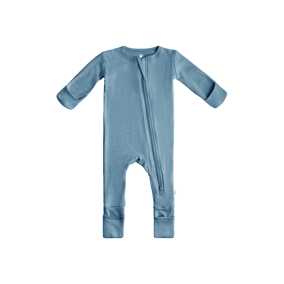 Baby in soft bamboo pajamas with DreamCuffs® from Dreamland Baby, showing the cozy, fitted sleepwear with fold-over cuffs.