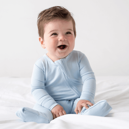 Soft baby bamboo pajamas with DreamCuffs® from Dreamland Baby, featuring a cozy fit and gentle fabric for comfortable sleep.