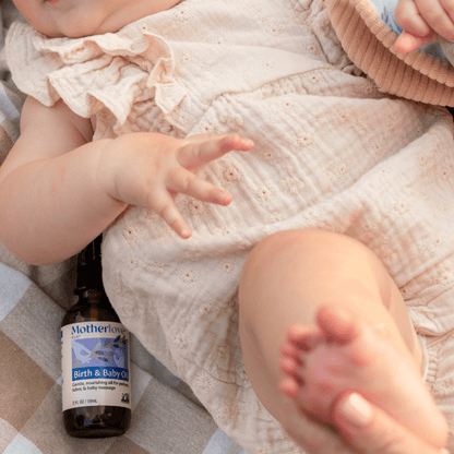 Baby birth and massage oil by Motherlove Herbal Company, gentle and nourishing baby oil with herbal ingredients.
