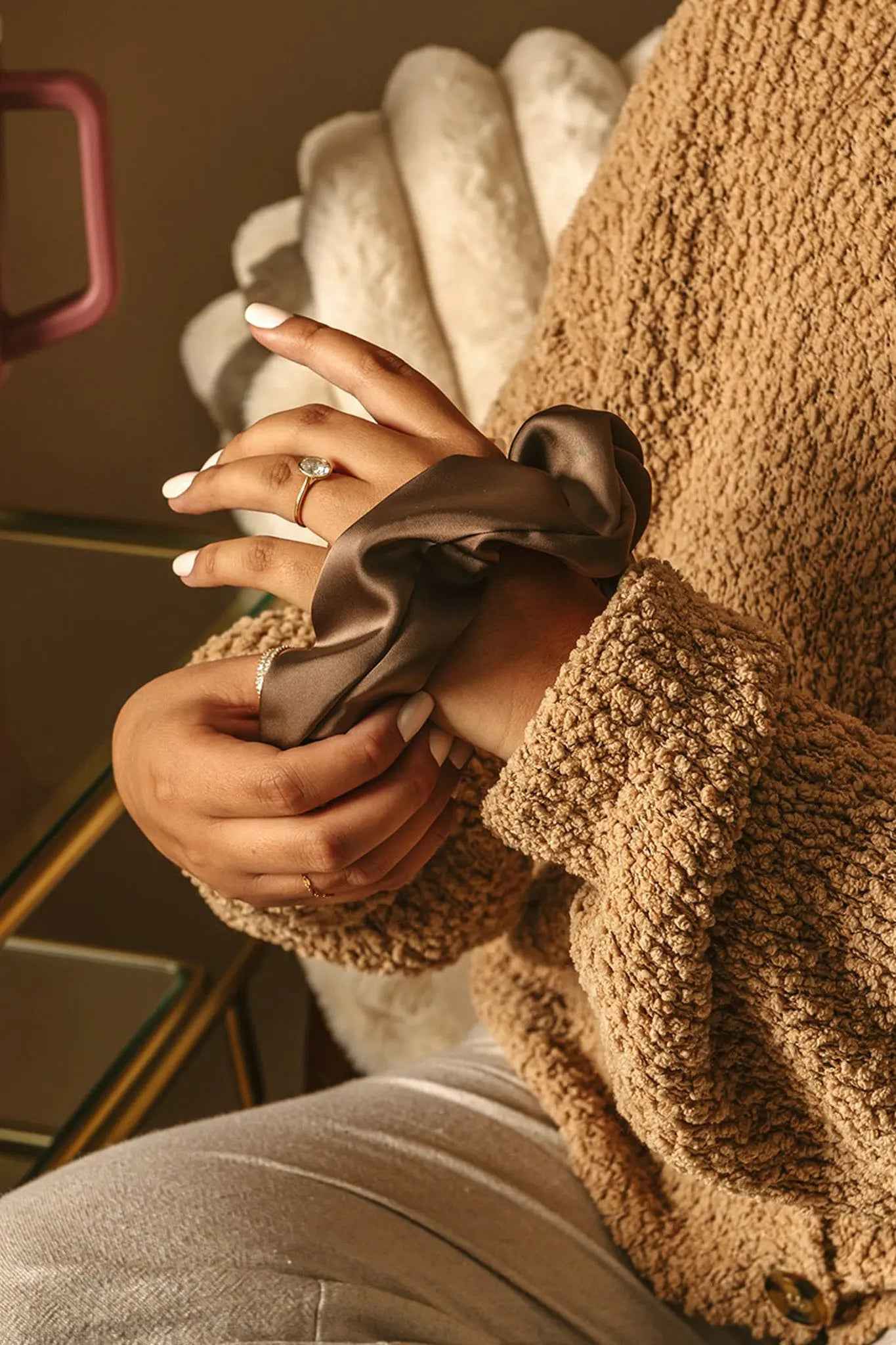 Le Lolo breastfeeding reminder scrunchie with a soft, colorful fabric band designed for nursing mothers.