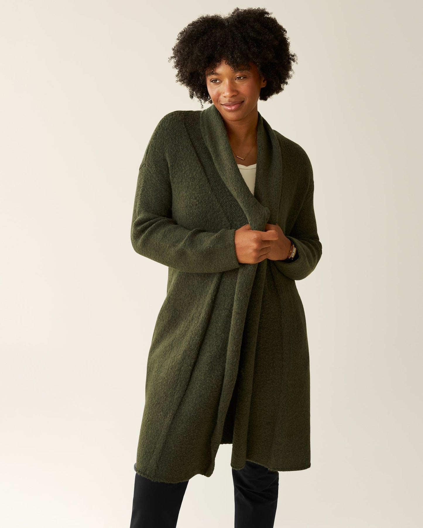 Kindred Bravely Chloe Cardigan Sweater in thyme, a cozy knit top with a relaxed fit, shown in a front view.