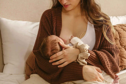 Colorful Le Lolo nipple shield system with multiple colored shields for sensitive skin protection.