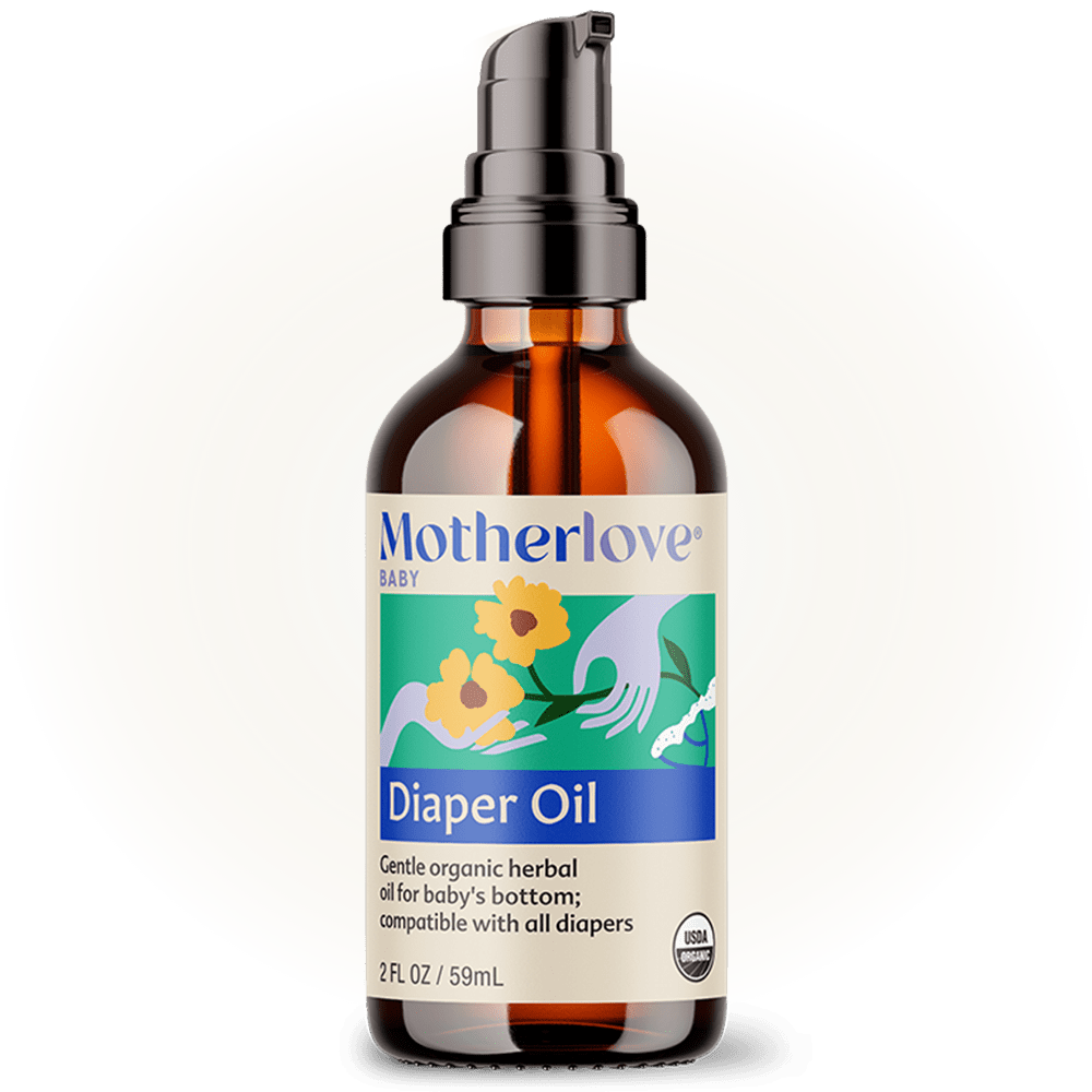 Baby diaper oil by Motherlove Herbal Company in a bottle with natural herbal ingredients and a pump dispenser.