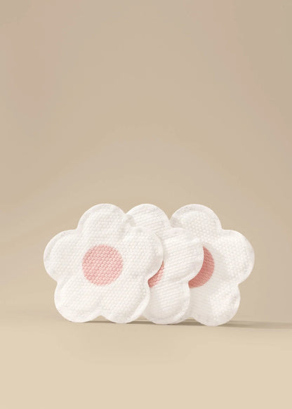 Disposable nursing pads by Le Lolo, soft absorbent pads for breastfeeding, shown in a close-up image.