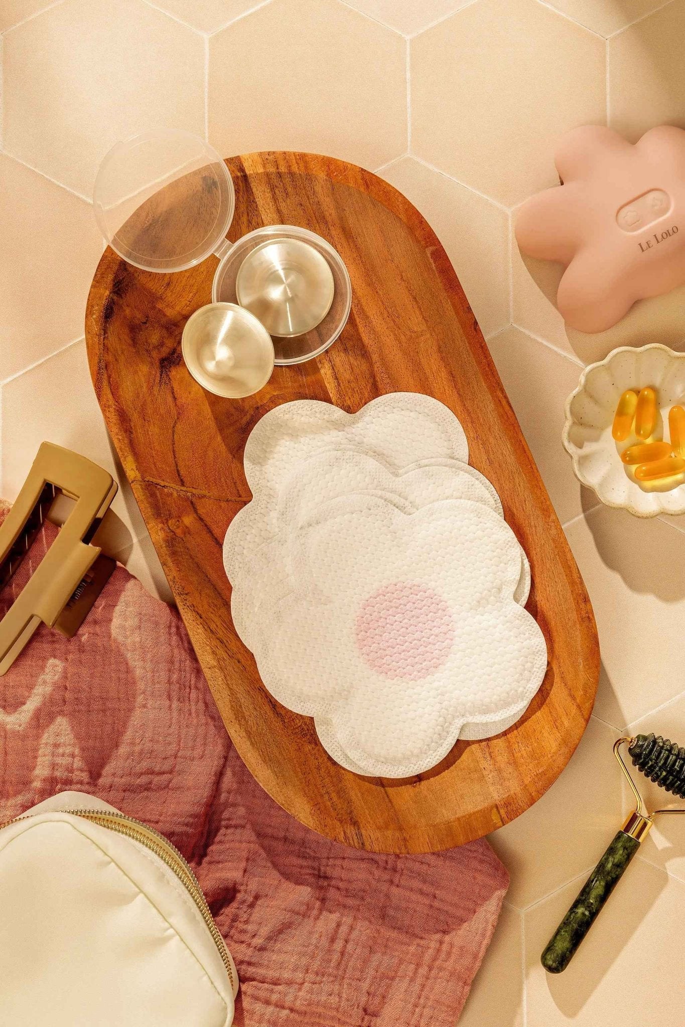 Le Lolo disposable nursing pads shown in their packaging, designed for absorbency and comfort during breastfeeding.