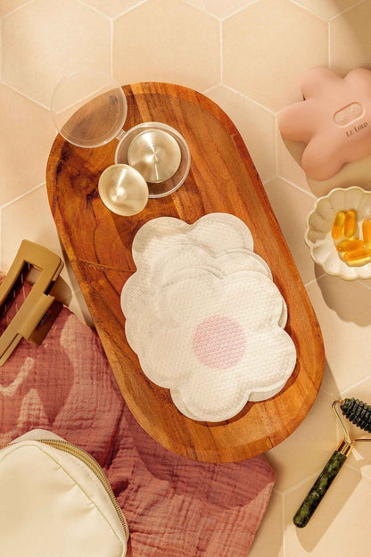 Le Lolo disposable nursing pads shown in their packaging, designed for absorbency and comfort during breastfeeding.