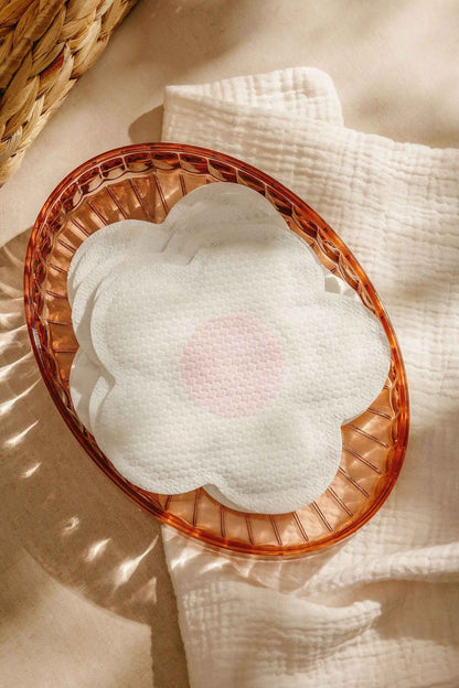 Le Lolo disposable nursing pads shown in a pack, soft and absorbent for breastfeeding comfort and leak protection.