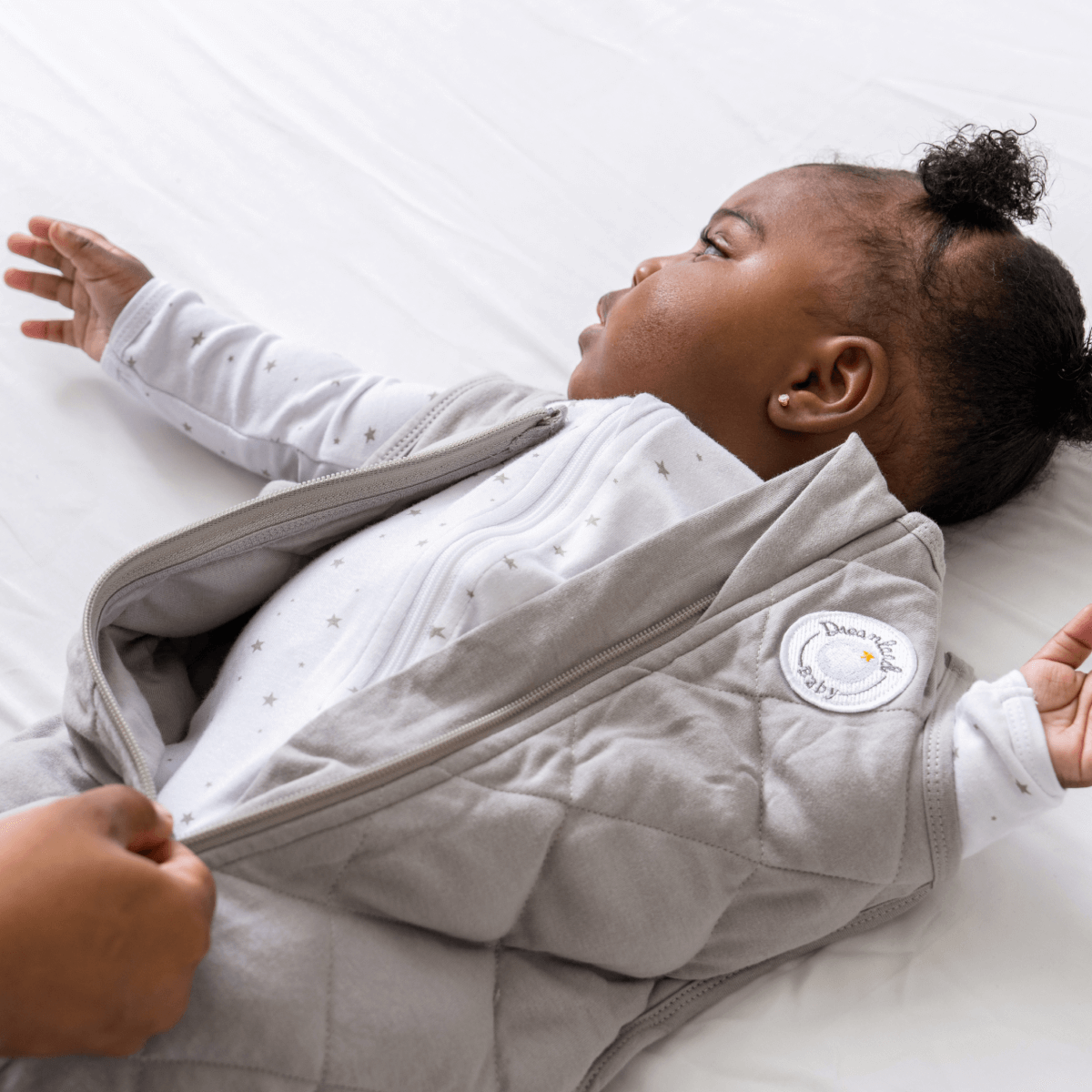 Dreamland Baby weighted sleep sack, soft fabric with adjustable straps and snug fit for safe, comfortable sleep.