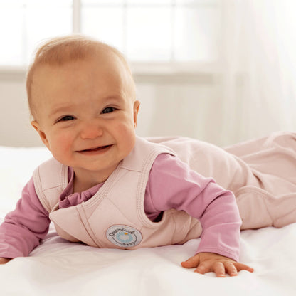 Dreamland Baby Dream Weighted Sleep Sack for infants, soft fabric with adjustable straps, designed for safe sleep comfort.