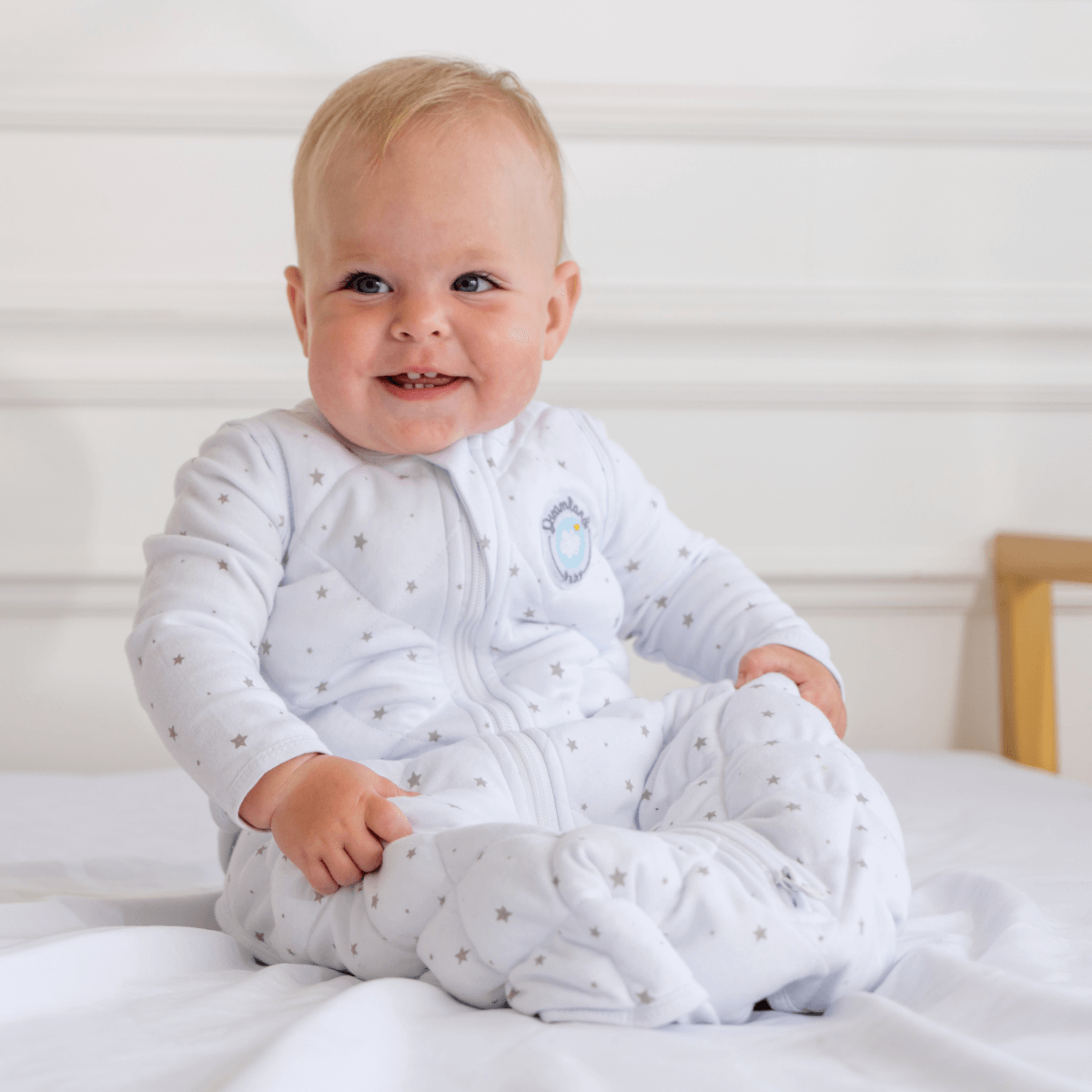 Dreamland Baby Dream Weighted Sleep Sack shown in soft fabric with adjustable straps and a cozy design for restful sleep.