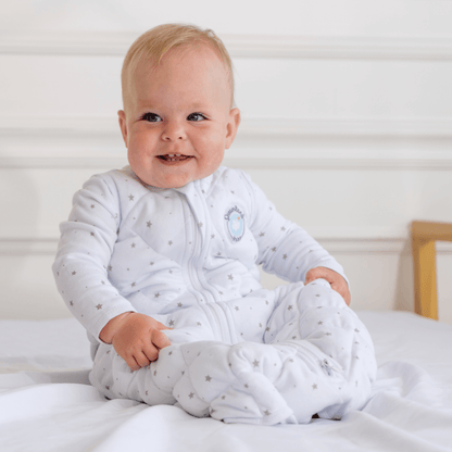 Dreamland Baby Dream Weighted Sleep Sack shown in soft fabric with adjustable straps and a cozy design for restful sleep.