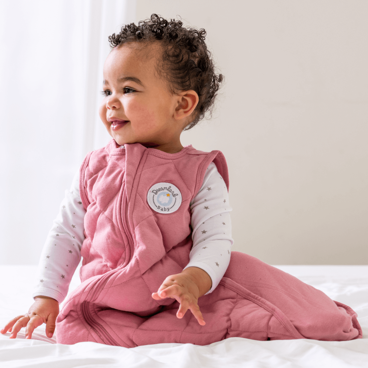 Dreamland Baby Dream Weighted Sleep Sack lying flat, soft fabric with adjustable straps for secure sleep comfort