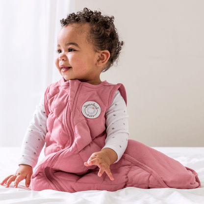 Dreamland Baby Dream Weighted Sleep Sack lying flat, soft fabric with adjustable straps for secure sleep comfort