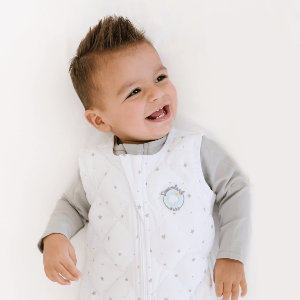 Dreamland Baby Dream Weighted Sleep Sack, soft fabric with adjustable straps, designed for safe, comfortable sleep for infants.