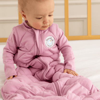 Dreamland Baby Dream Weighted Sleep Sack lying flat, soft fabric, designed for safe sleep and comfort for babies.