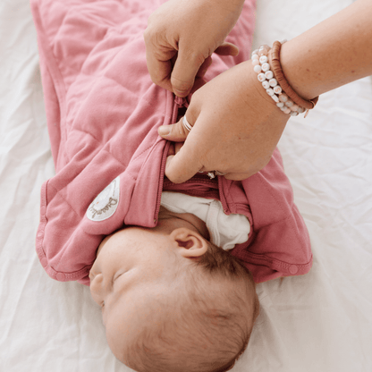 Dreamland Baby Dream Weighted Sleep Swaddle, soft fabric with secure wrap design for calming sleep, suitable for newborns and infants
