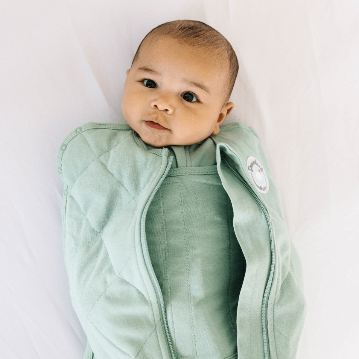 Dreamland Baby Dream Weighted Sleep Swaddle, soft fabric with adjustable design for comfortable, secure sleep for infants.
