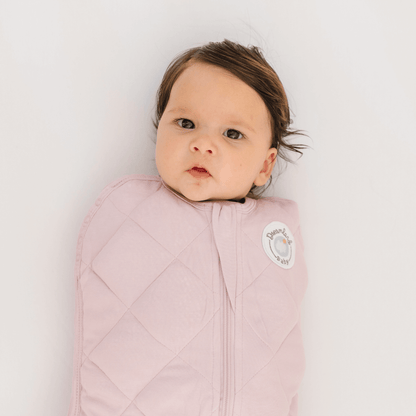 Dreamland Baby Dream Weighted Sleep Swaddle in soft fabric, designed to gently soothe and secure infants for comfortable sleep.