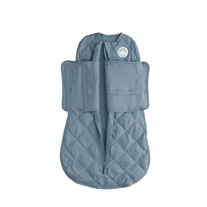 Dreamland Baby Dream Weighted Sleep Swaddle, a soft fabric swaddle designed for secure calming sleep for infants.
