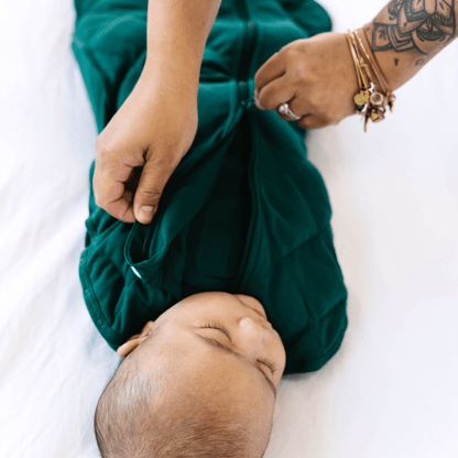 Dreamland Baby Dream Weighted Sleep Swaddle, soft fabric with secure wrap design for calming and comfortable sleep.