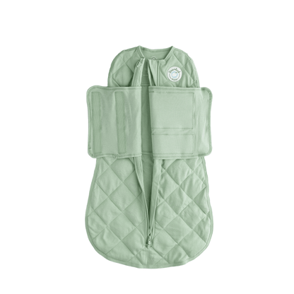 Dreamland Baby Dream Weighted Sleep Swaddle wrapped around a baby for secure, calming sleep with soft, breathable fabric.