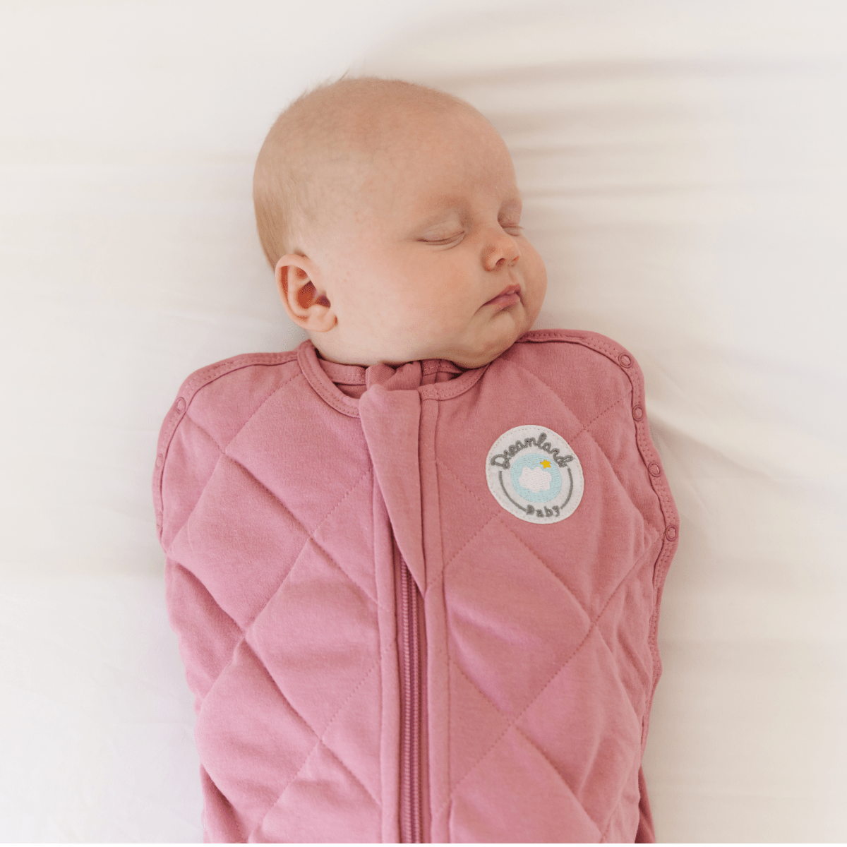 Dreamland Baby Dream Weighted Sleep Swaddle in soft fabric, designed to provide soothing comfort for infants during sleep.