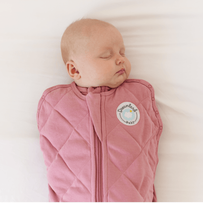 Dreamland Baby Dream Weighted Sleep Swaddle in soft fabric, designed to provide soothing comfort for infants during sleep.