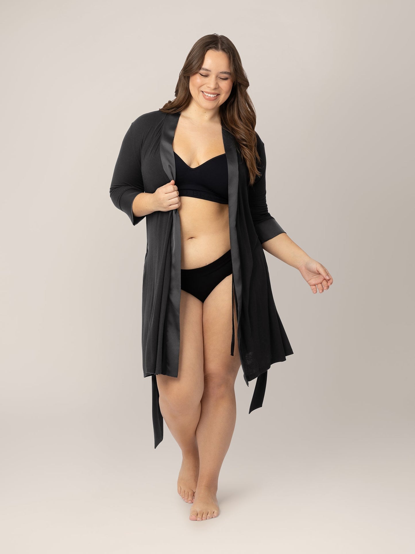 Black Emmaline Robe by Kindred Bravely, featuring soft fabric, long sleeves, and a relaxed fit, displayed on a hanger.