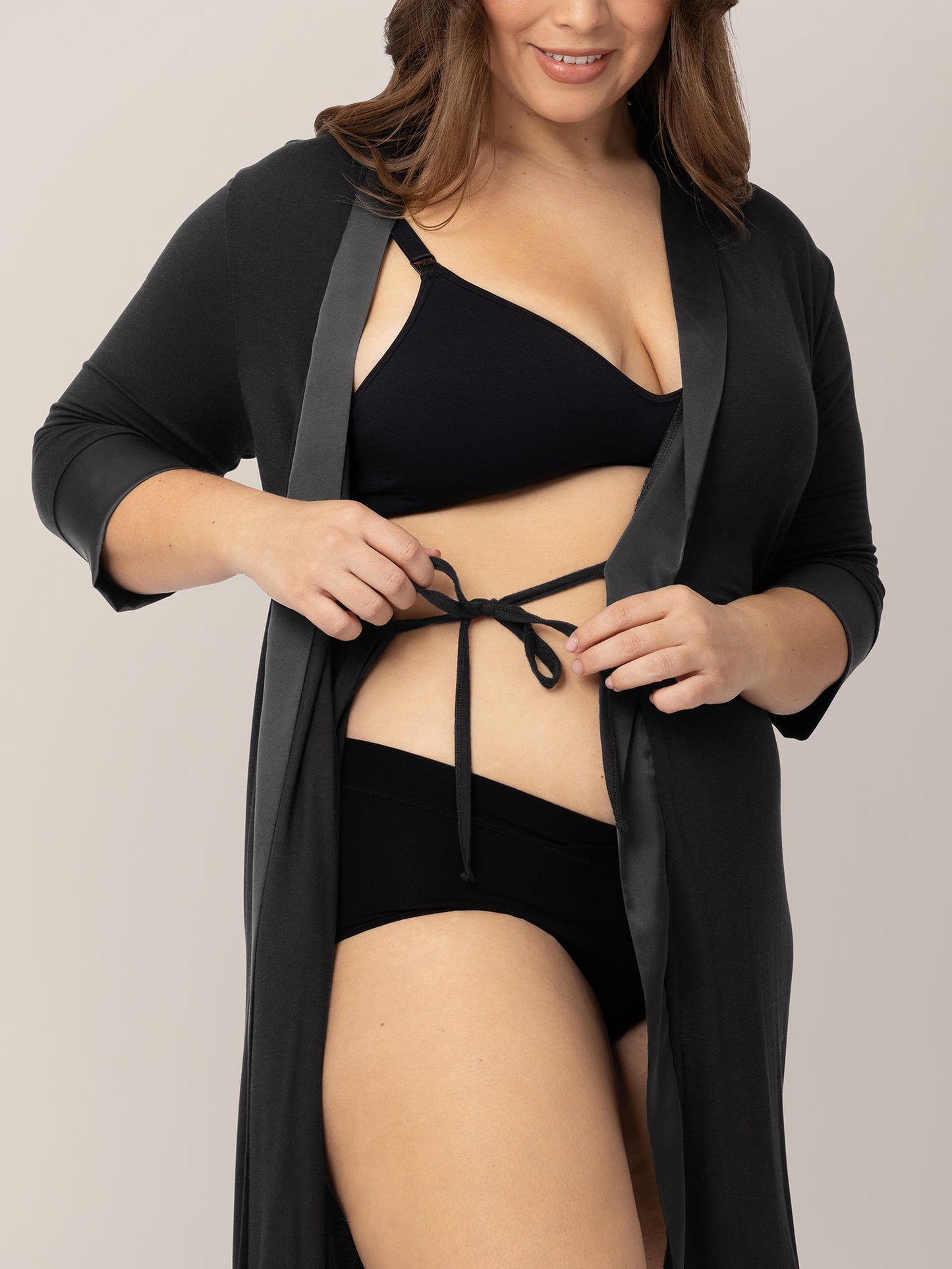 Black Emmaline Robe by Kindred Bravely, featuring soft fabric and a relaxed fit, displayed hanging with a tie waist detail.