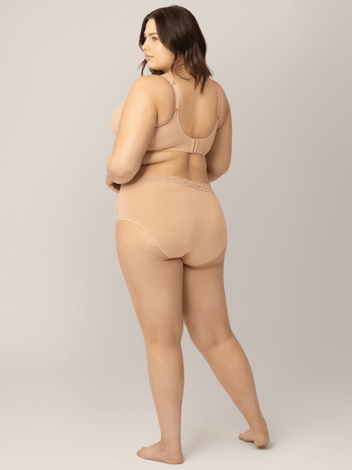 Set of high-waisted postpartum underwear from Kindred Bravely in assorted neutral colors, soft and comfortable for new mothers.