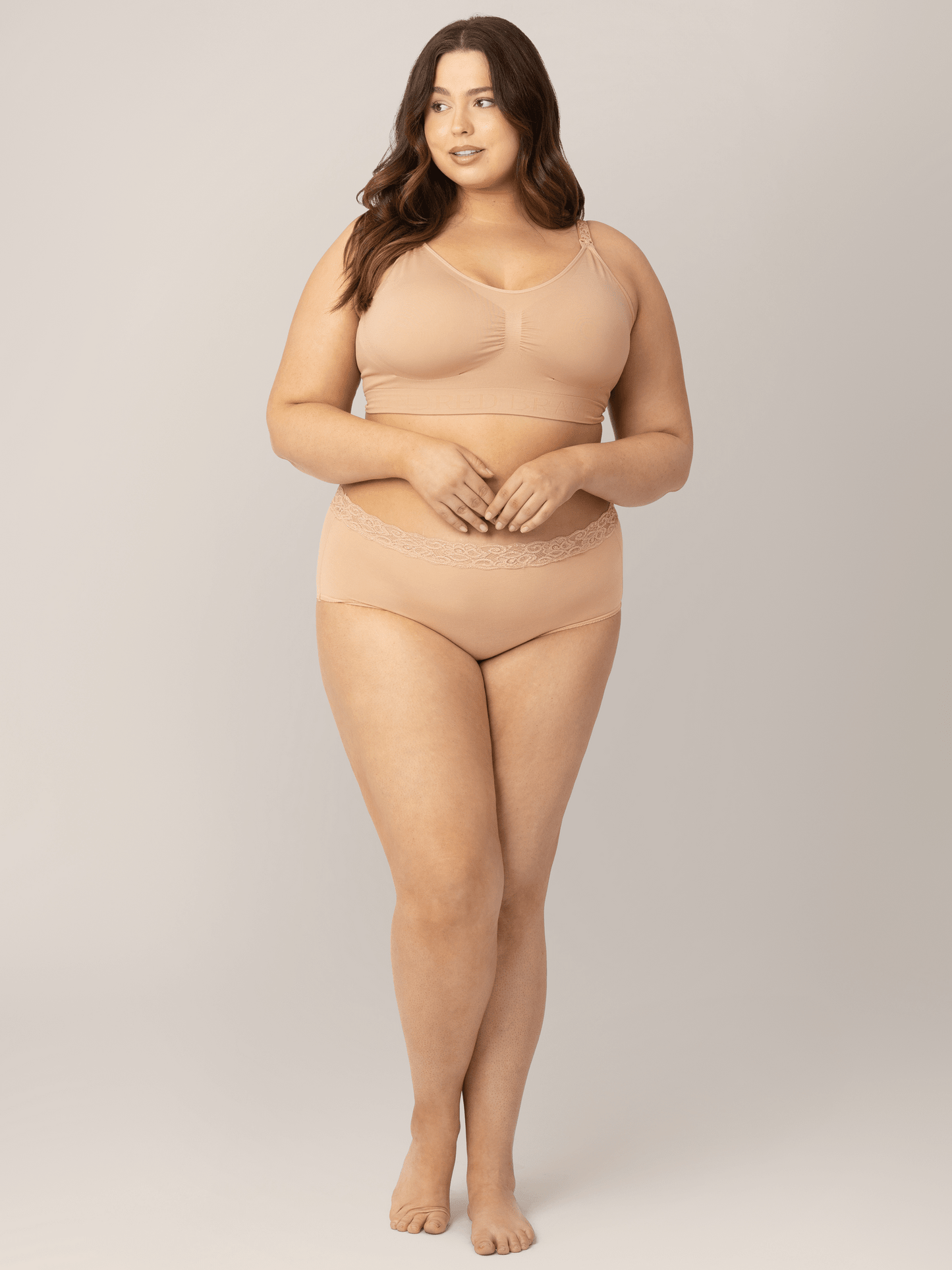Set of high-waisted postpartum underwear from Kindred Bravely in assorted neutral colors, showcasing soft, comfortable fabric and fit.