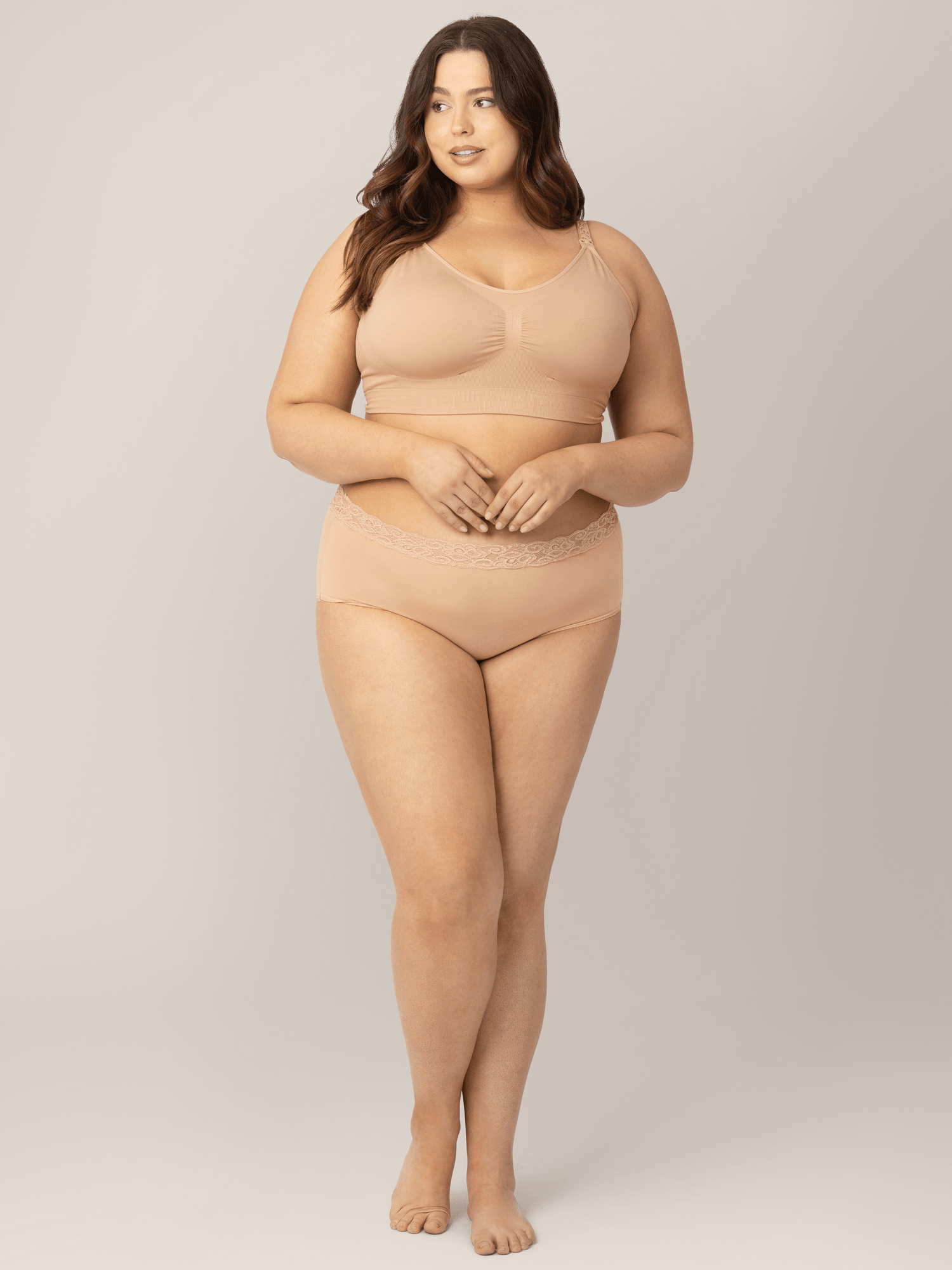 Set of high-waisted postpartum underwear from Kindred Bravely in assorted neutral colors, showcasing soft, comfortable fabric and fit.