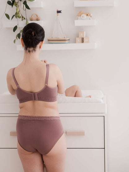Set of high-waisted postpartum underwear in dusty hues by Kindred Bravely, featuring soft, comfortable fabric and full coverage.