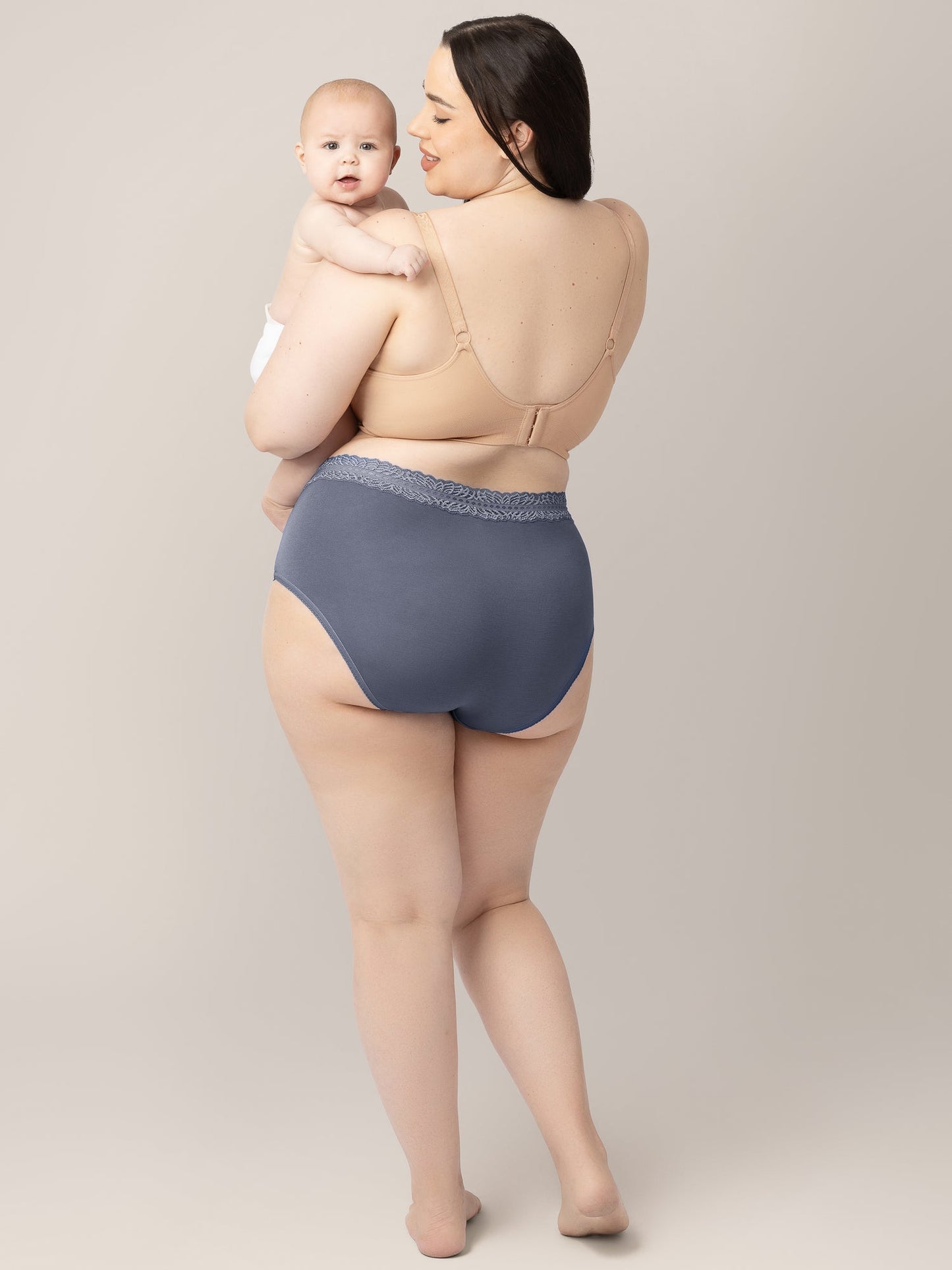 Set of high-waisted postpartum underwear in dusty hues by Kindred Bravely, showcasing soft, comfortable fabric and supportive fit.