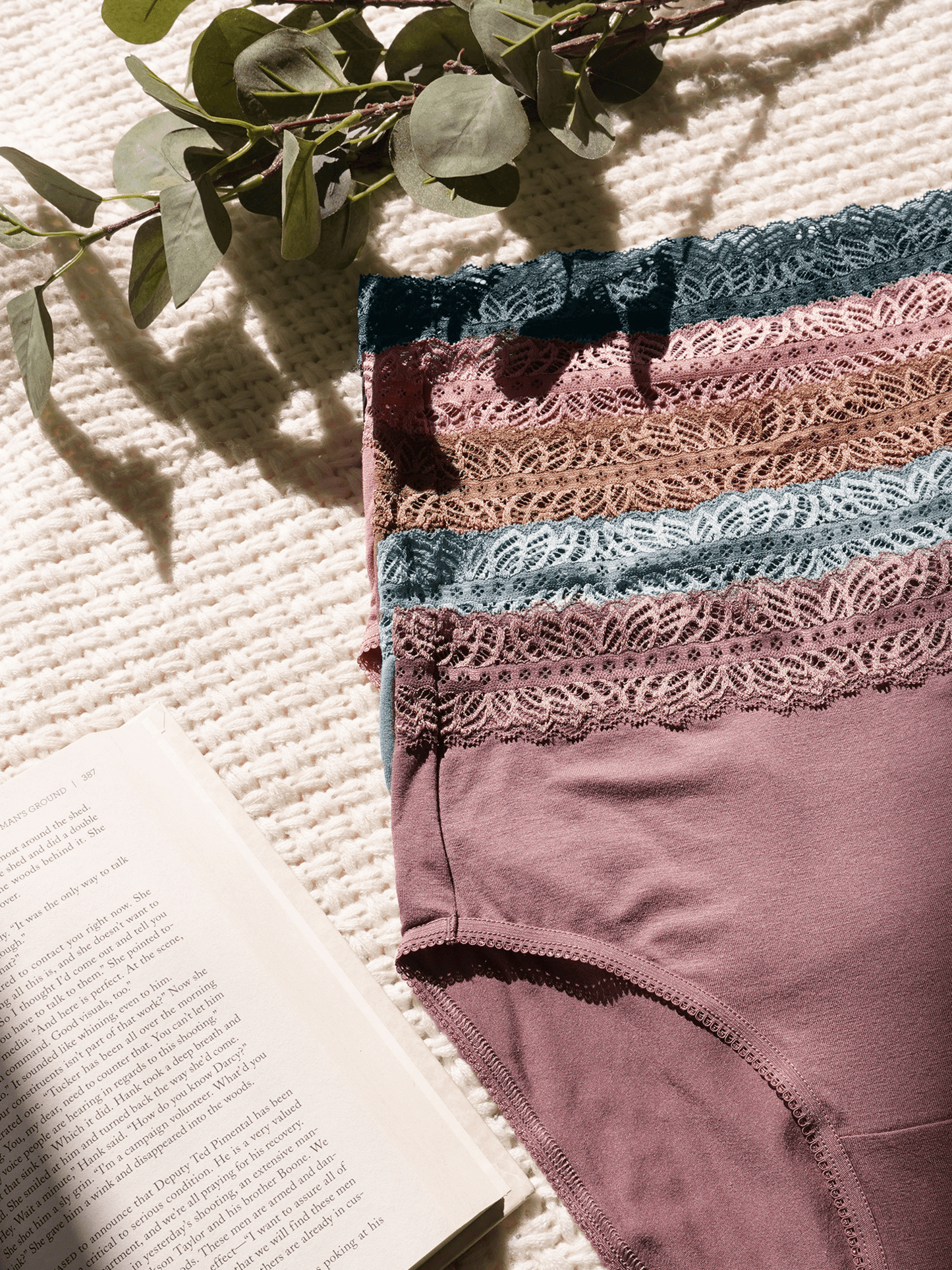 Set of high-waisted postpartum underwear in dusty hues by Kindred Bravely, featuring soft, comfortable fabric and full coverage.