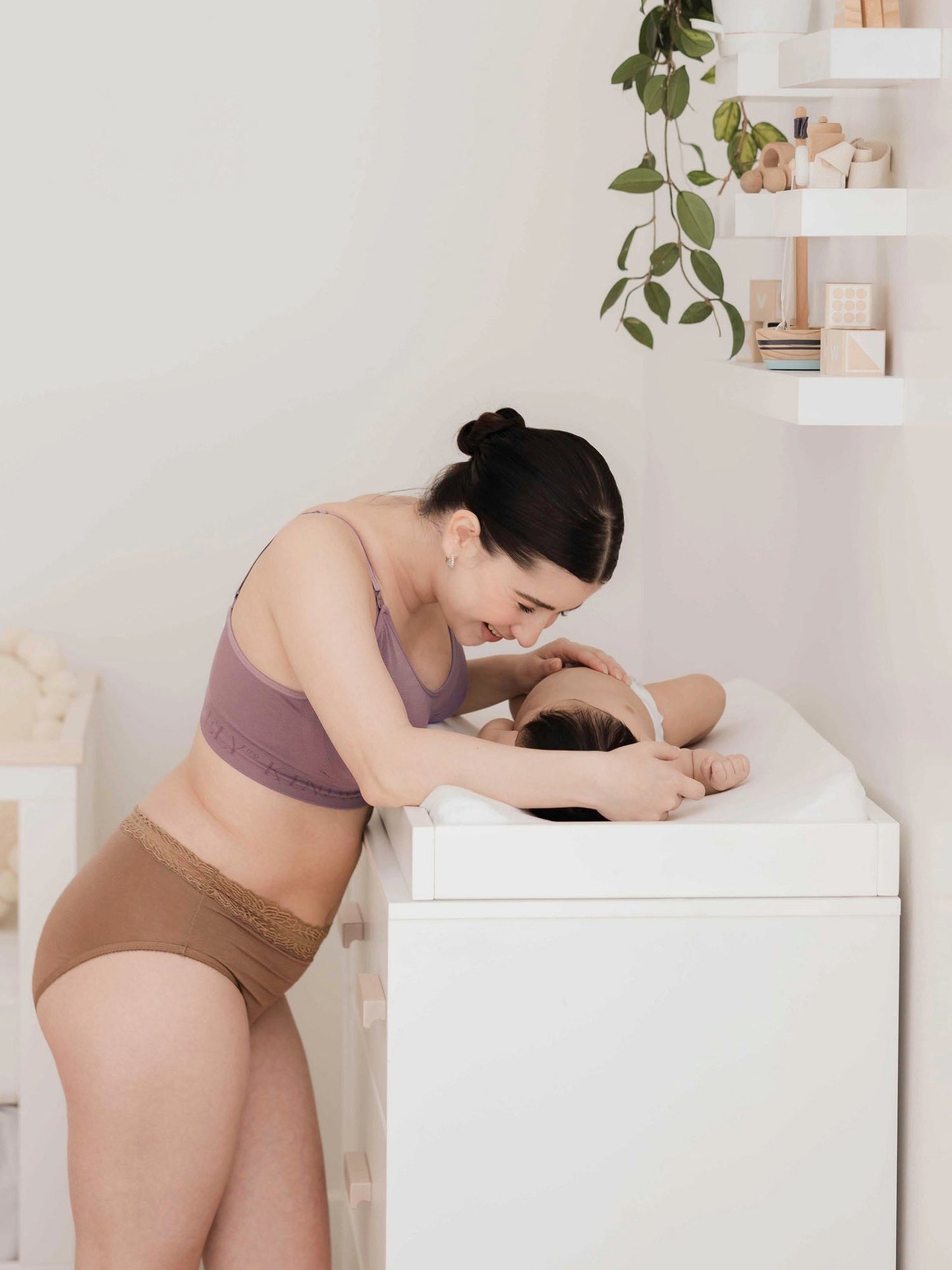 Set of high-waisted postpartum underwear in dusty hues by Kindred Bravely, featuring soft, comfortable fabric and supportive fit.