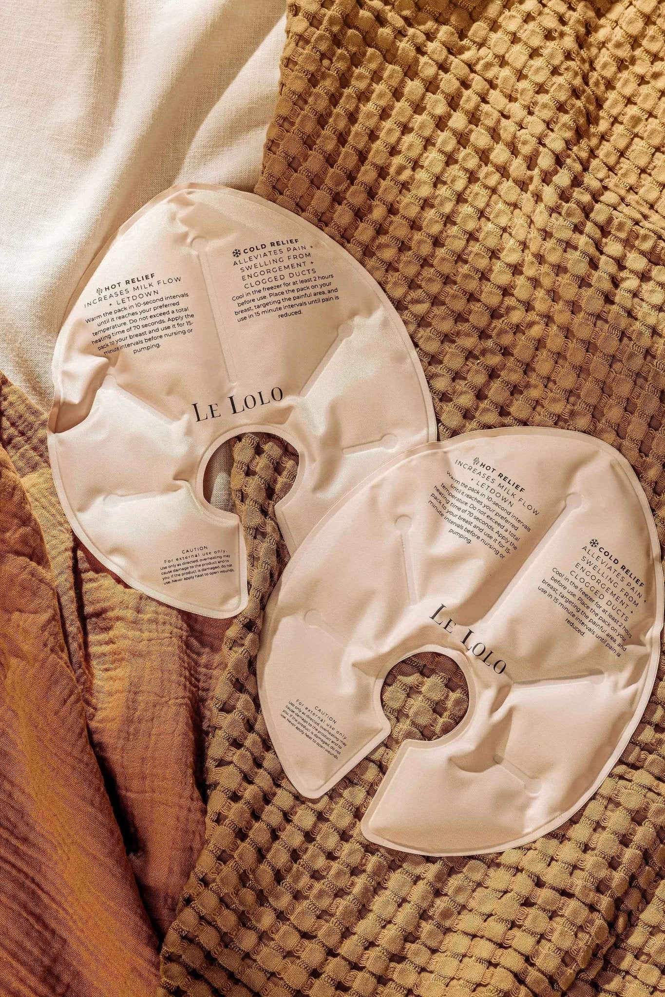 Le Lolo hot and cold breast therapy packs shown in a soft fabric pouch, designed for soothing postpartum comfort and relief.