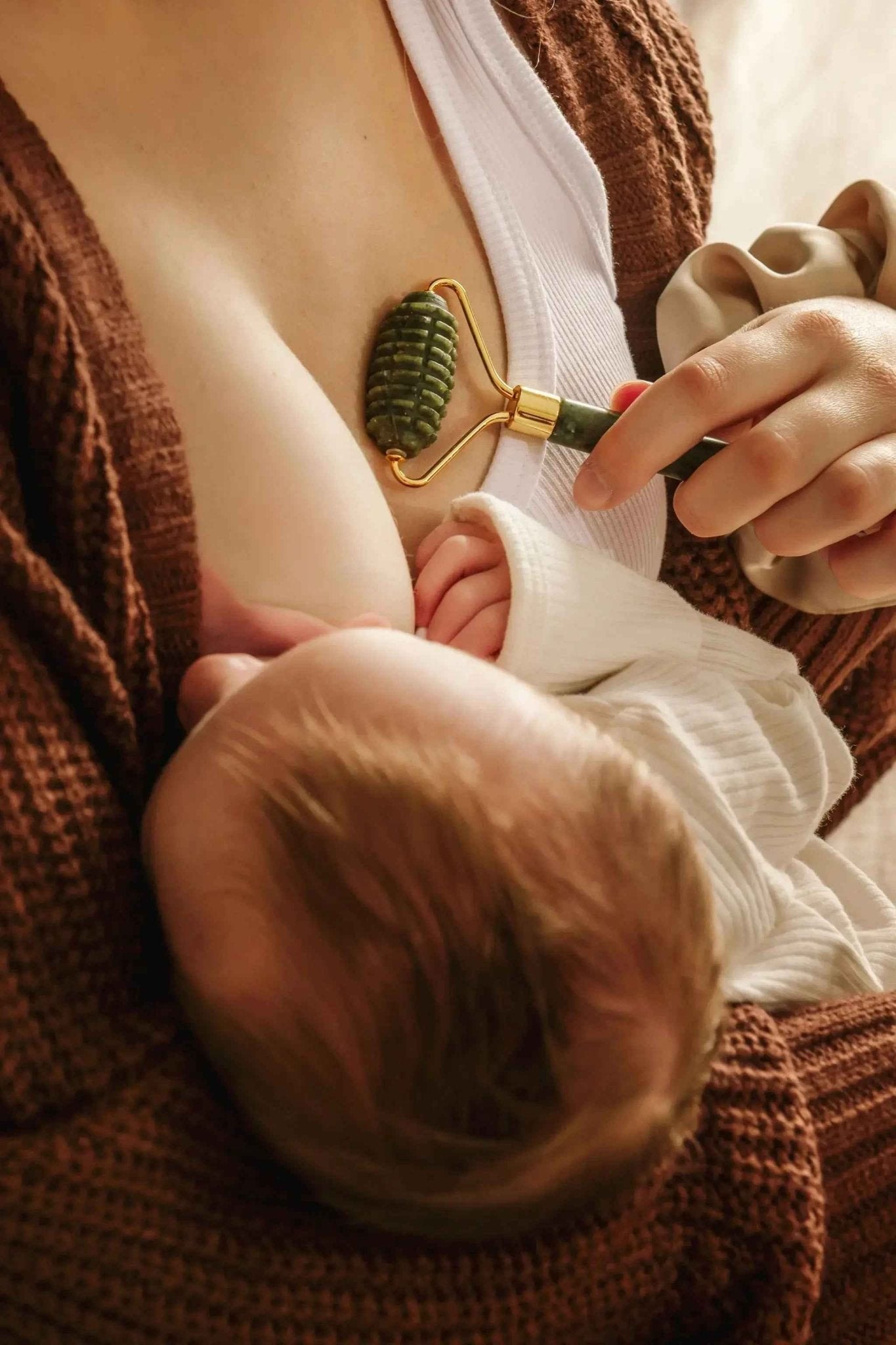 Le Lolo lactation jade roller with smooth jade stones for breast massage and soothing relief.